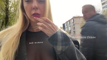 A chick displays her globes while ambling in public in the city